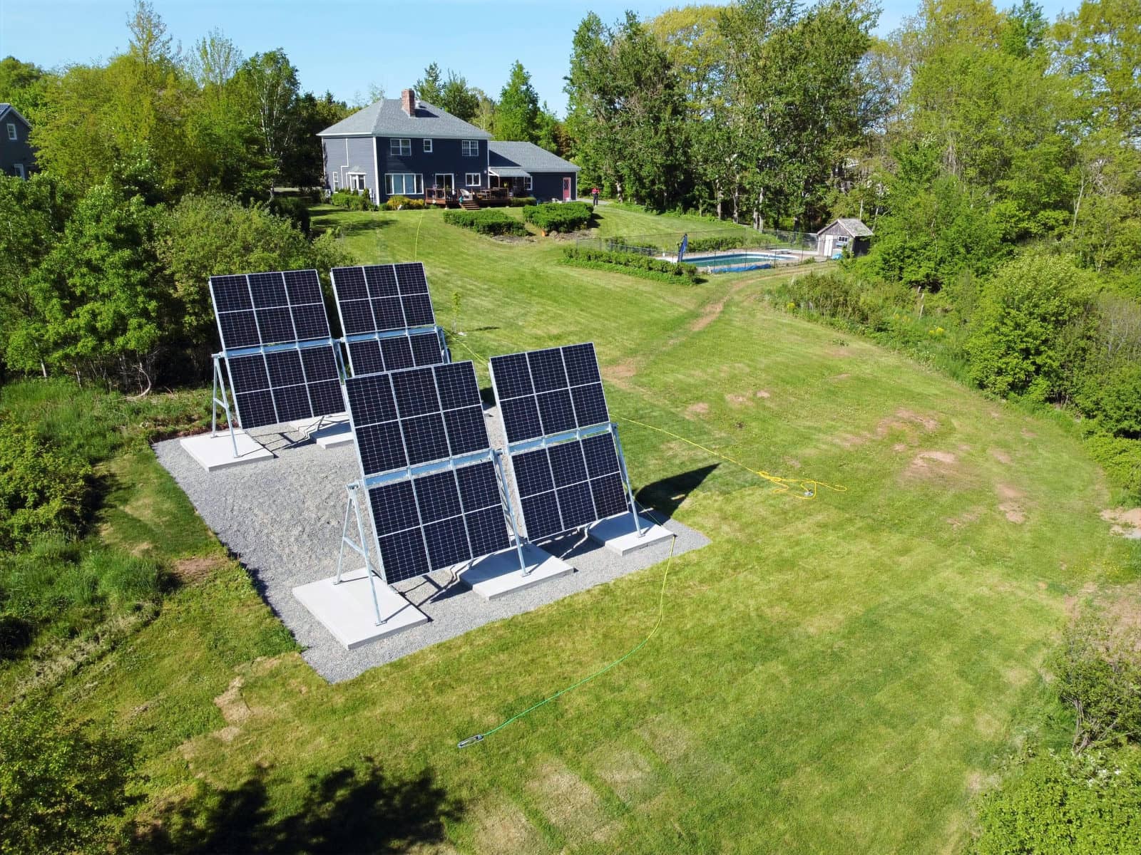 Square-configuration A-Frame arrays with pebble landscaping in Kentville