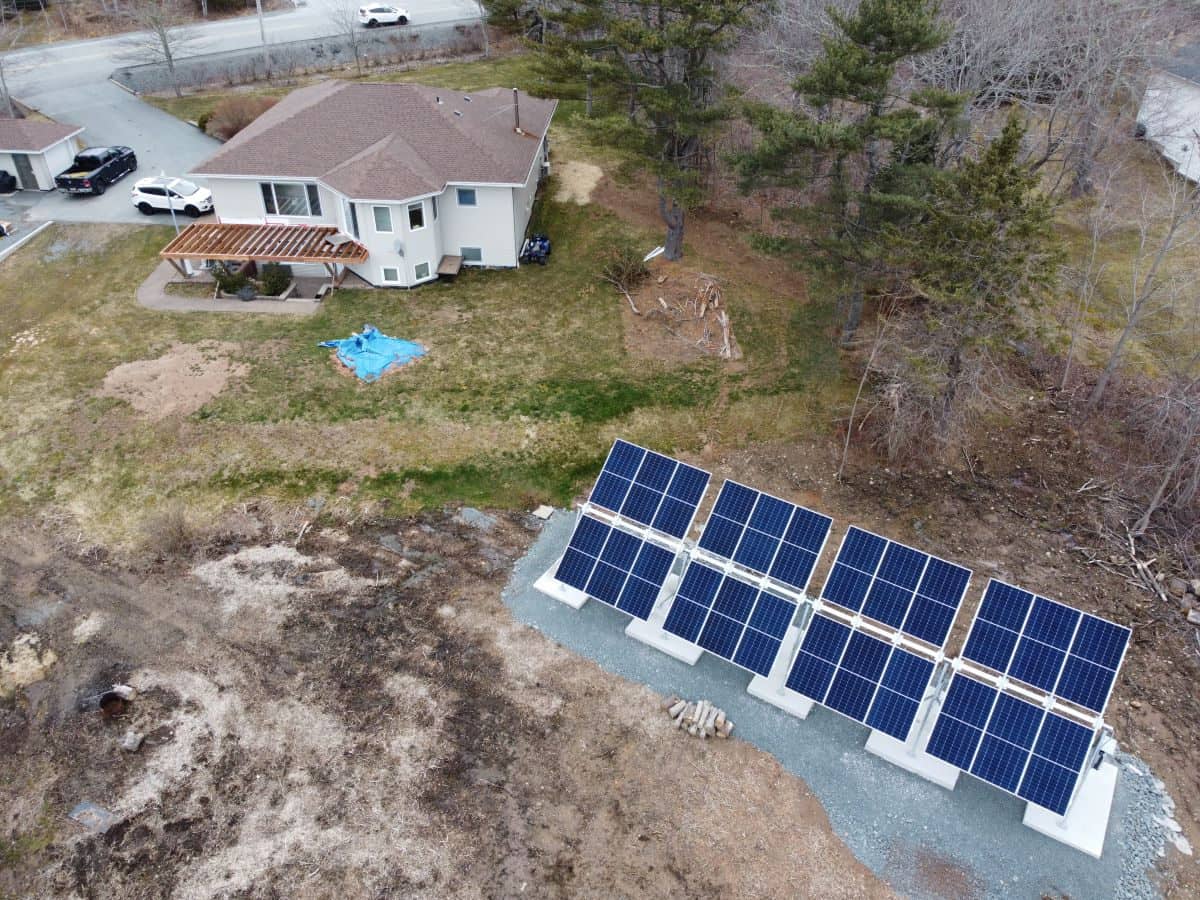 24-panel seasonally adjustable array anchored to concrete pads in Windsor Junction